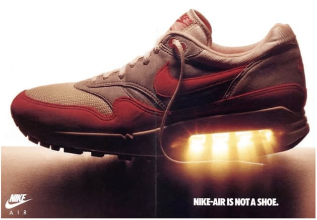 A nike air shoe in brown and red